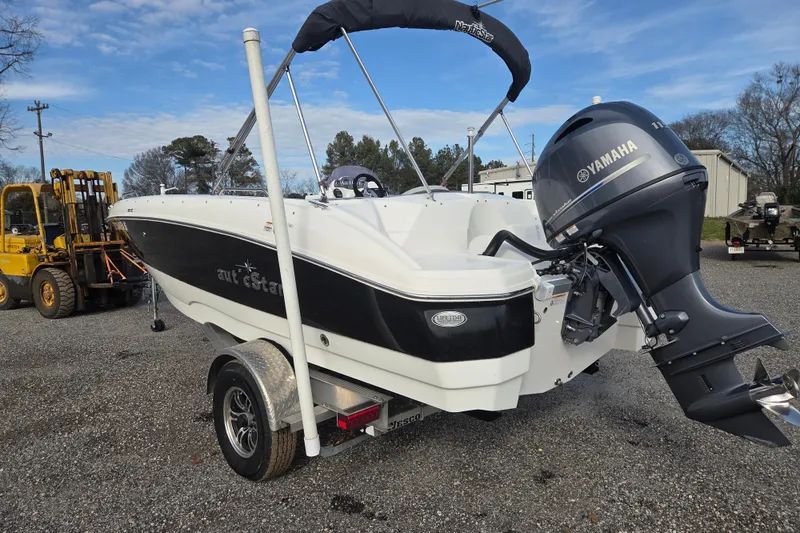 Slide: The Image of 2022 NauticStar 193 SC boat with Yamaha outboard motor on trailer. - 6