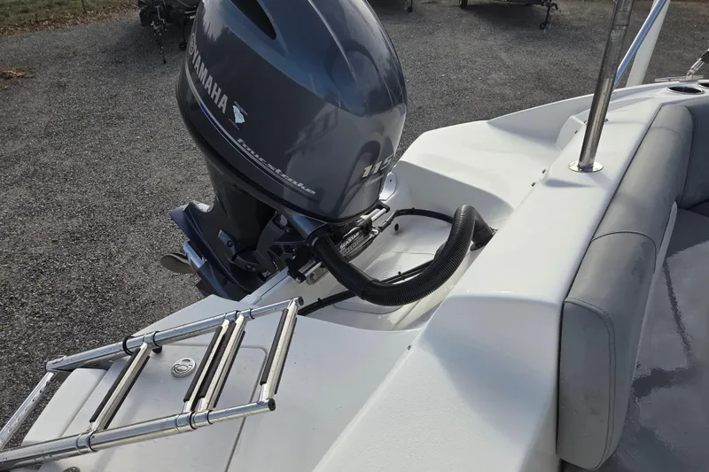 Slide: The Image of 2022 NauticStar 193 SC boat with Yamaha outboard motor and swim ladder. - 9