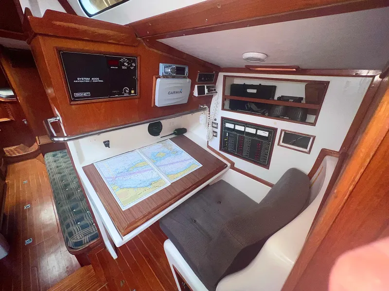 Slide: The Image of Navigation station in 1980 Lafitte 44 sailboat with chart table and instruments. - 21