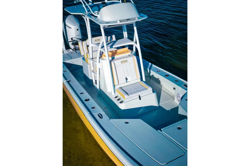 Slide: The Image of Broadwater Boatworks 25 Bay Cat 2026 on turquoise water near bridge. - 11