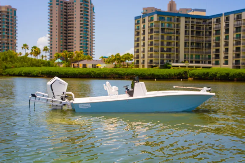 Slide: The Image of 2026 Broadwater Boatworks 25 Bay Cat on water near urban buildings. - 17