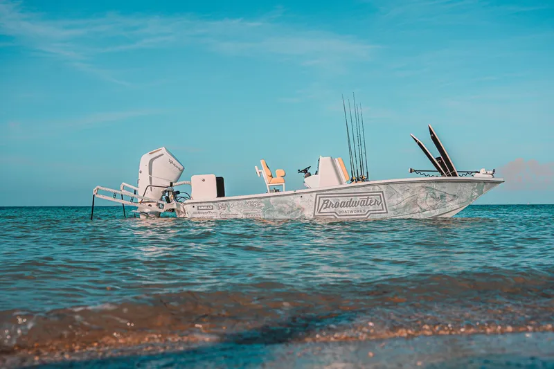 Slide: The Image of 2026 Broadwater Boatworks 25 Bay Cat on calm ocean waters under clear blue sky. - 22