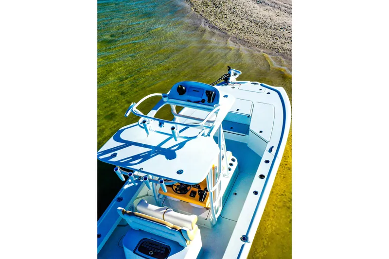 Slide: The Image of 2026 Broadwater Boatworks 25 Bay Cat on shallow water, showcasing sleek design and spacious deck. - 9