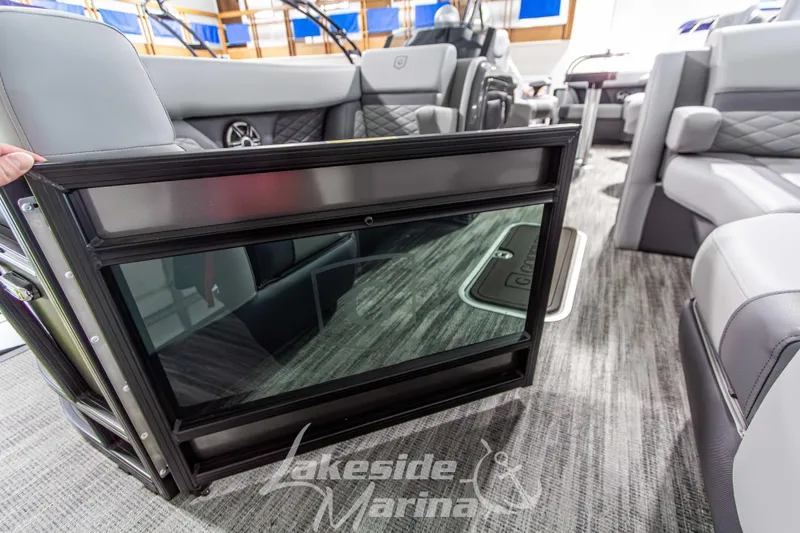 Slide: The Image of Interior of 2026 Godfrey Monaco 235 QSB boat with luxurious seating and flooring. - 14