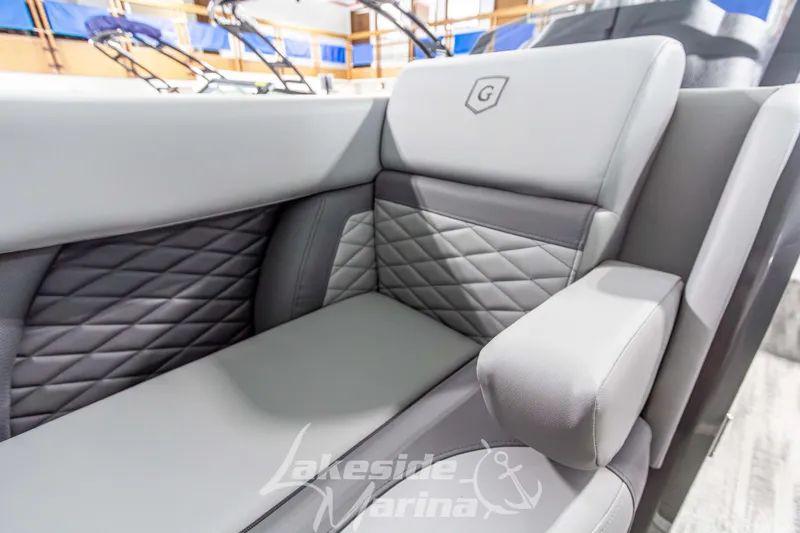 Slide: The Image of Luxurious seating on 2026 Godfrey Monaco 235 QSB boat, featuring quilted upholstery and armrest. - 15