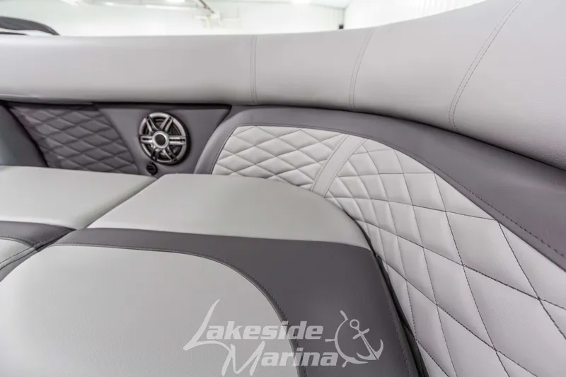 Slide: The Image of Luxurious interior of 2026 Godfrey Monaco 235 QSB with quilted upholstery and speaker detail. - 17
