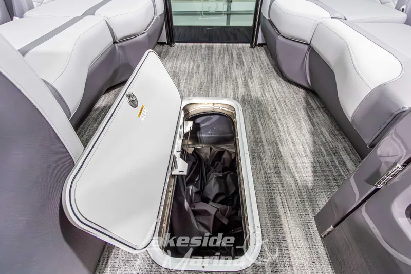 Slide: The Image of 2026 Godfrey Monaco 235 QSB boat interior with open storage compartment. - 20