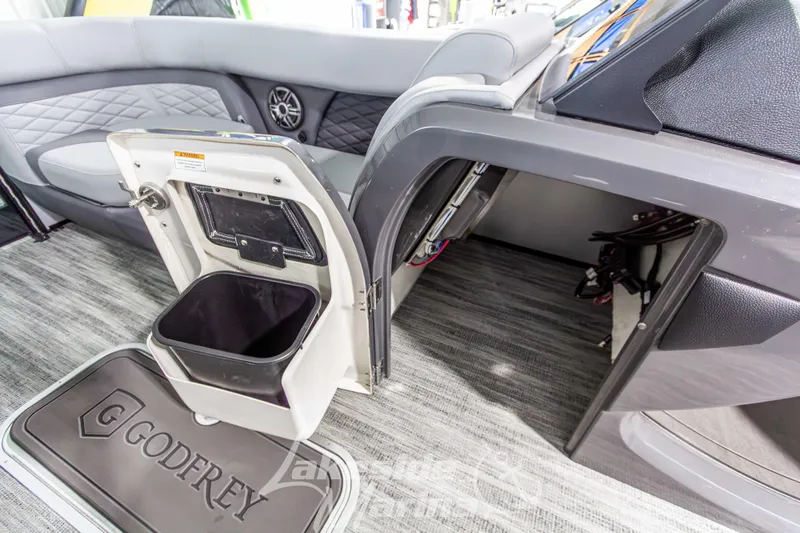 Slide: The Image of Interior of 2026 Godfrey Monaco 235 QSB boat with storage compartments and seating. - 21