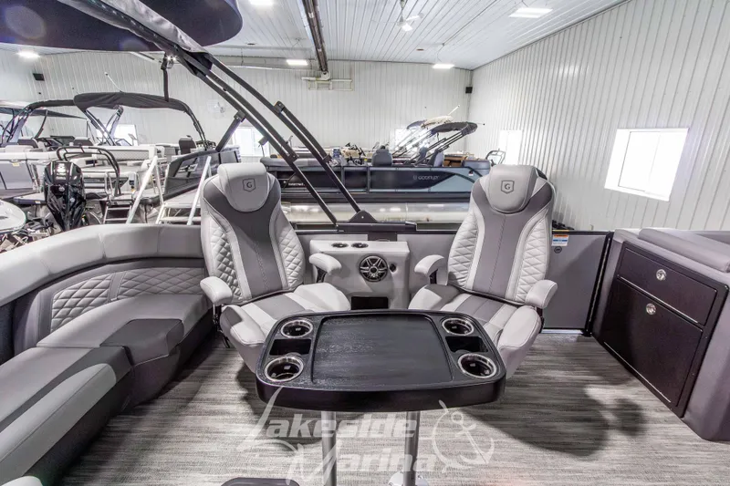 Slide: The Image of Luxurious interior of 2026 Godfrey Monaco 235 QSB pontoon boat with plush seating. - 30
