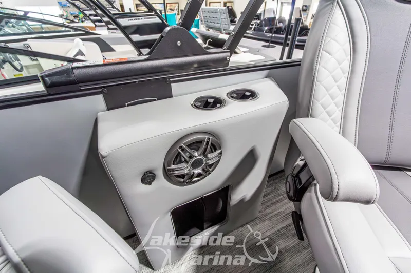 Slide: The Image of 2026 Godfrey Monaco 235 QSB boat interior with speaker and cup holders. - 31