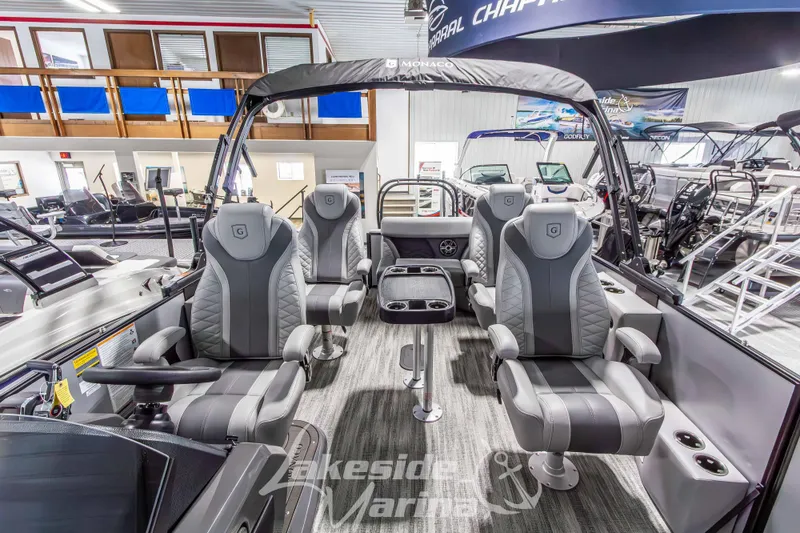 Slide: The Image of 2026 Godfrey Monaco 235 QSB pontoon boat interior with luxurious seating at Lakeside Marina. - 32