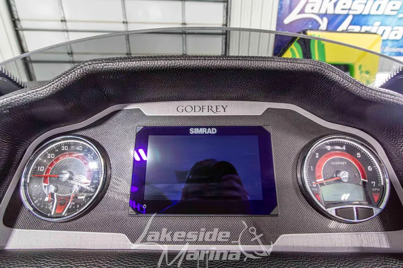 Slide: The Image of Dashboard of 2026 Godfrey Monaco 235 QSB with Simrad display and gauges. - 35