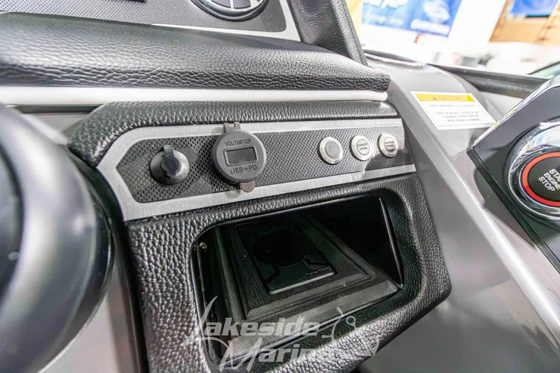 Slide: The Image of 2026 Godfrey Monaco 235 QSB dashboard with USB port and start/stop button. - 37