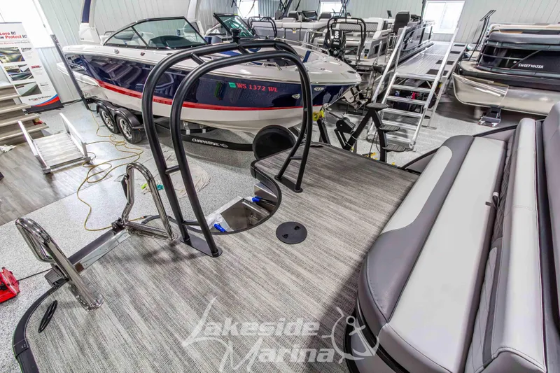 Slide: The Image of 2026 Godfrey Monaco 235 QSB pontoon boat interior at Lakeside Marina showroom. - 45