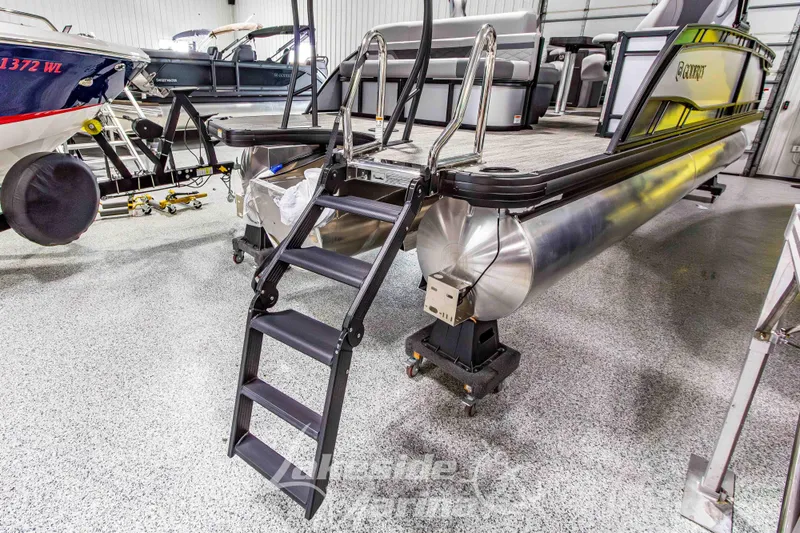 Slide: The Image of 2026 Godfrey Monaco 235 QSB pontoon boat with boarding ladder in showroom. - 5