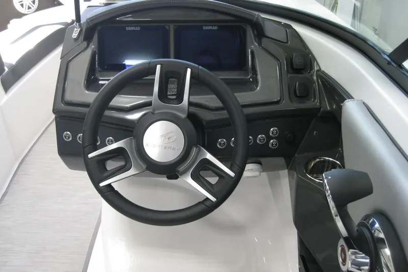 Slide: The Image of Captain's seat and controls of 2025 Monterey 238SS Super Sport boat, featuring sleek design. - 10