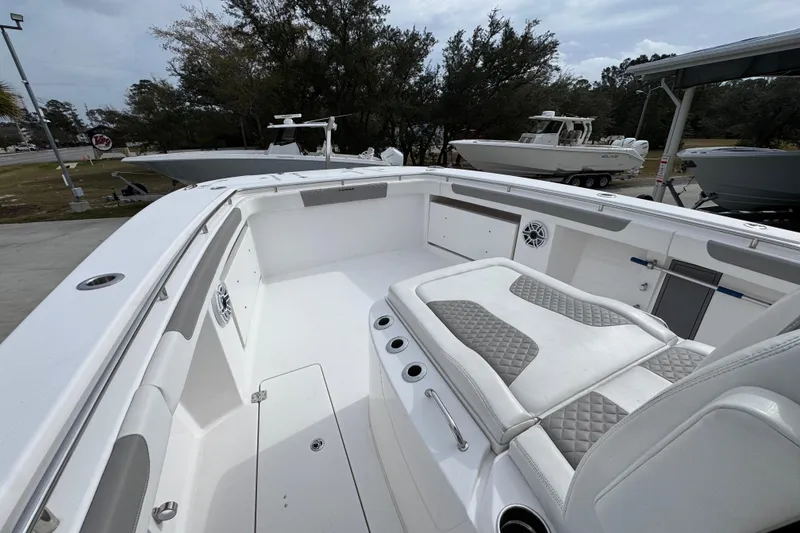 Slide: The Image of 2024 Caymas 34 CT boat interior with white seating and modern design. - 22