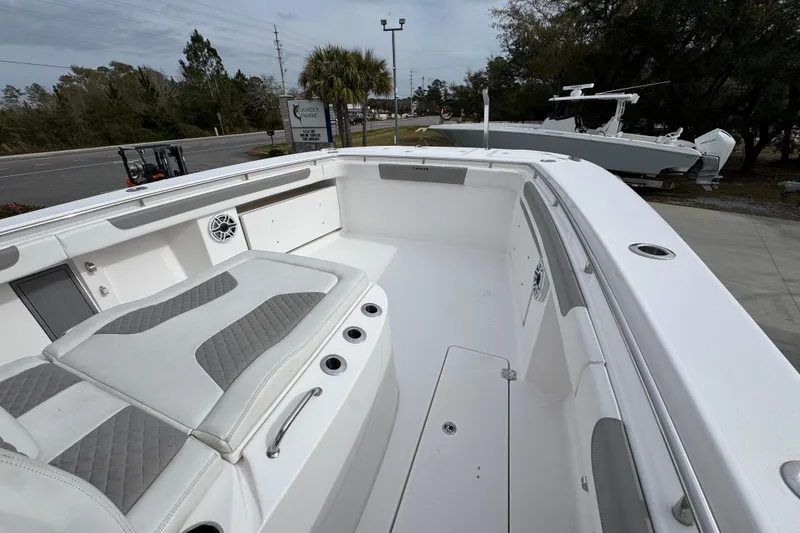 Slide: The Image of 2024 Caymas 34 CT boat interior with cushioned seating and sleek design. - 23