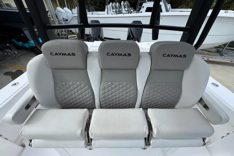 Slide: The Image of 2024 Caymas 34 CT boat seating with gray and white cushioned design. - 28