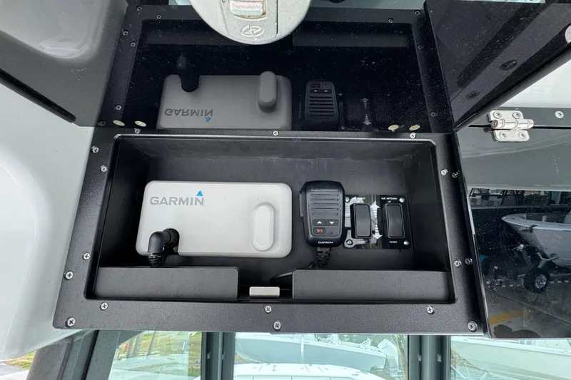 Slide: The Image of 2024 Caymas 34 CT boat dashboard with Garmin electronics and communication devices. - 33