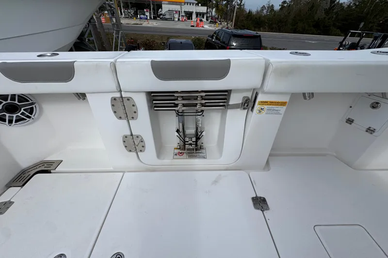 Slide: The Image of 2024 Caymas 34 CT boat interior with storage compartment and speaker. - 39