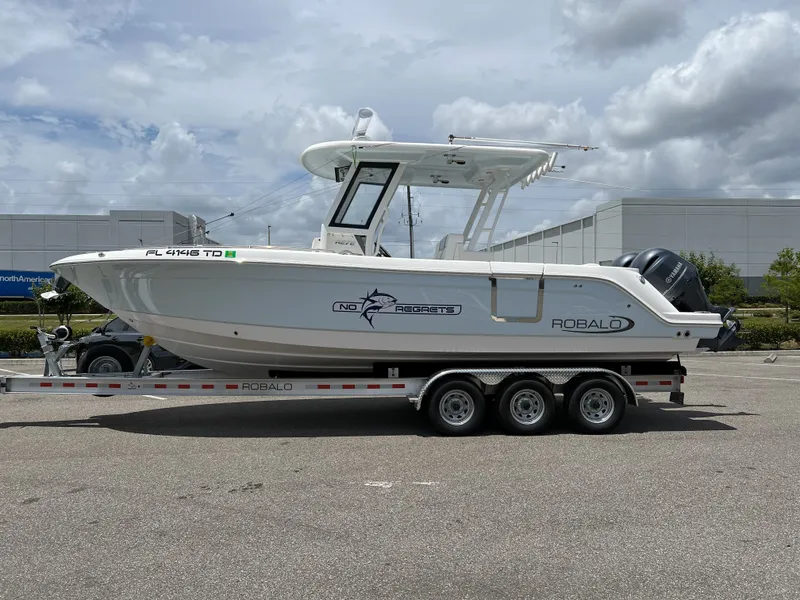 The Image of 2022 Robalo R272 Center Console on trailer, side view. - 0