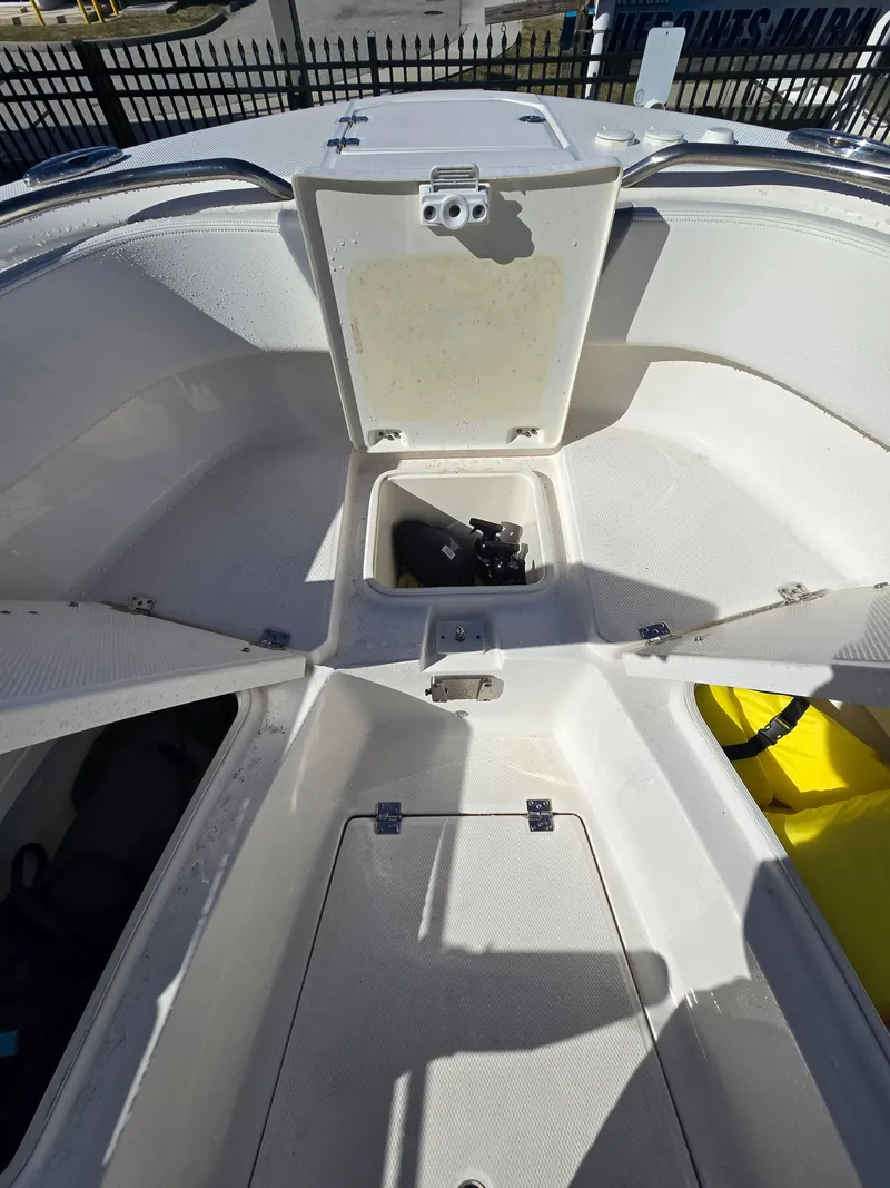 Slide: The Image of 2022 Robalo R272 Center Console with open storage compartment. - 12