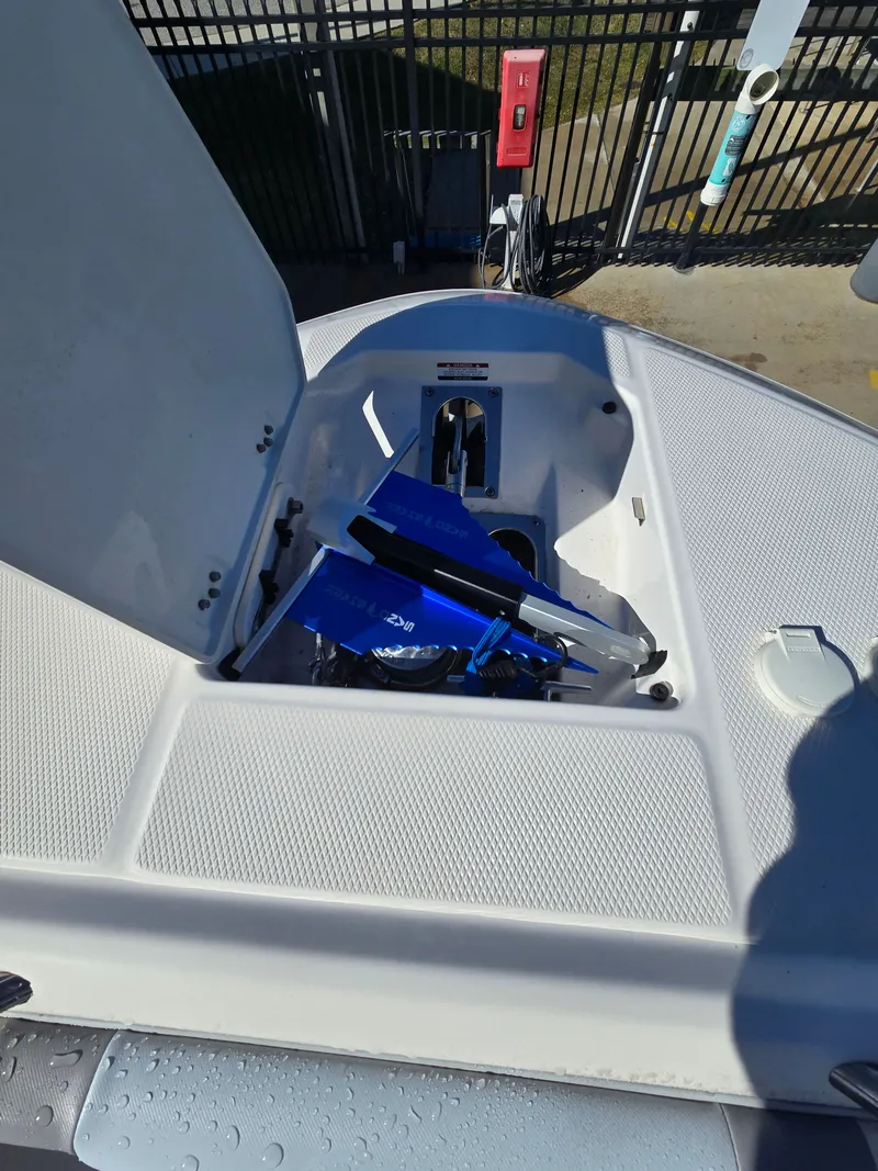 Slide: The Image of 2022 Robalo R272 Center Console with open storage compartment. - 14