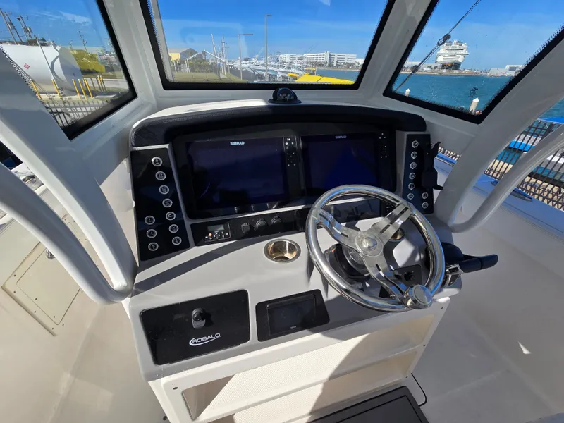 Slide: The Image of Robalo R272 Center Console 2022 helm with Simrad displays. - 21