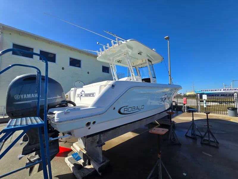 Slide: The Image of 2022 Robalo R272 Center Console boat on a dock. - 3