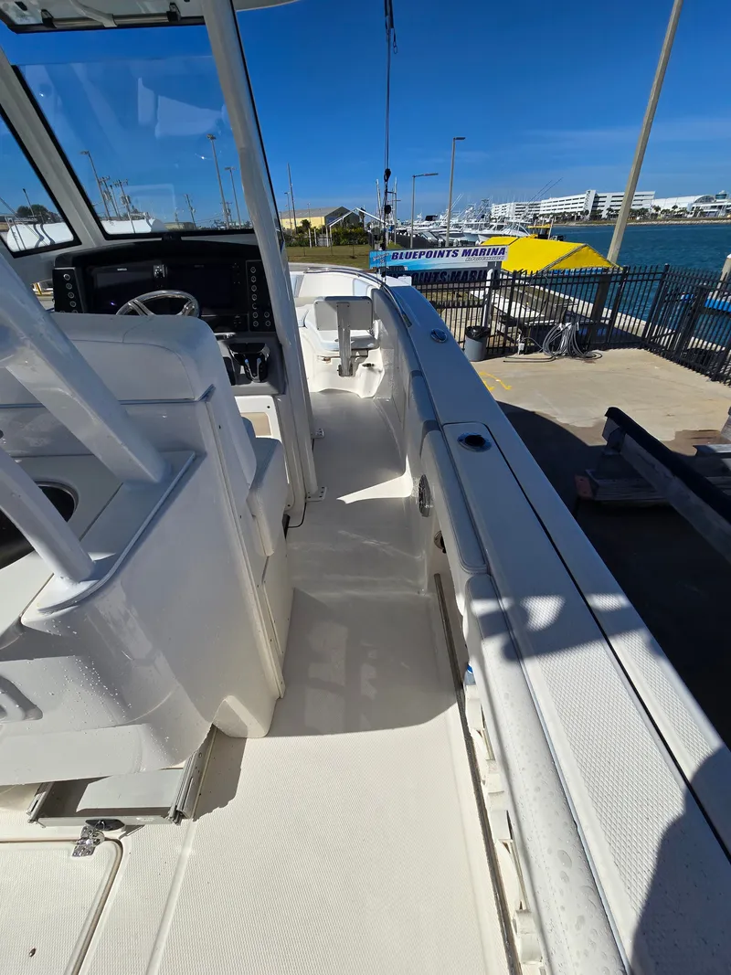 Slide: The Image of Robalo R272 Center Console 2022 at dock, sunny day. - 32