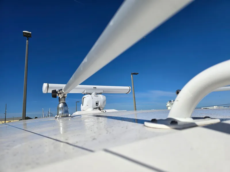 Slide: The Image of Robalo R272 Center Console 2022 with radar against blue sky. - 37