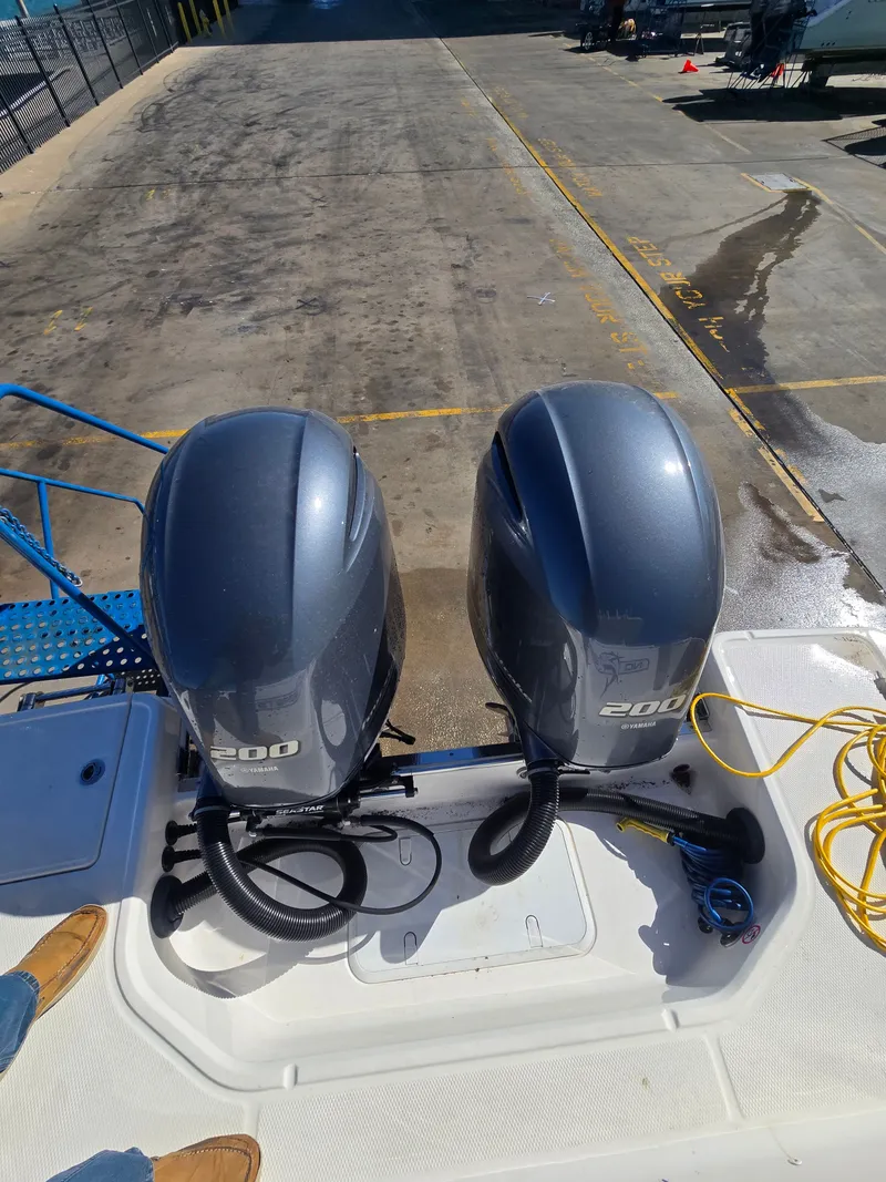 Slide: The Image of Two outboard motors on a 2022 Robalo R272 Center Console boat. - 39