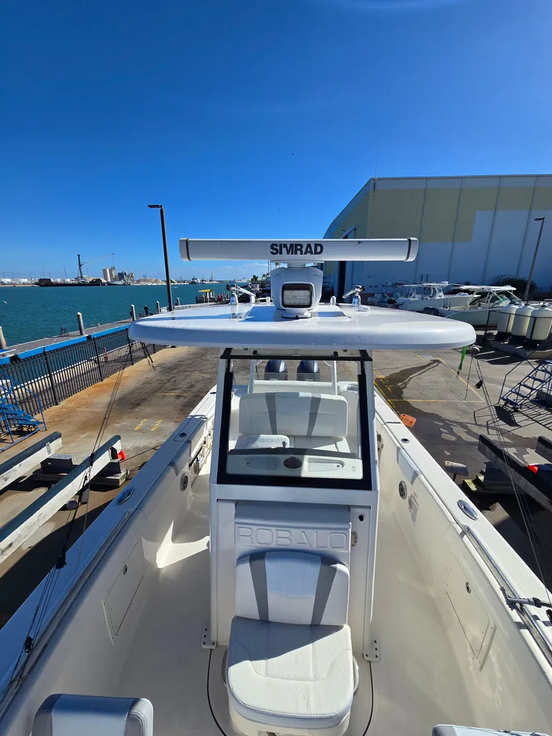 Slide: The Image of 2022 Robalo R272 Center Console boat at dock. - 6