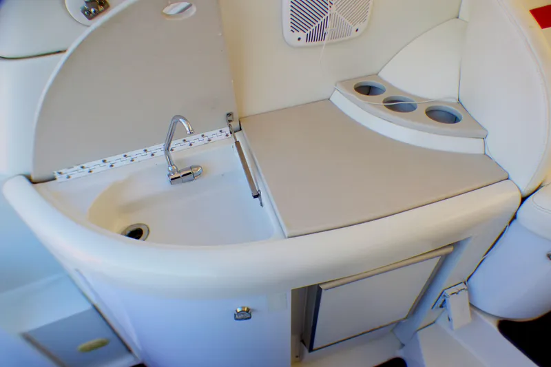 Slide: The Image of 2003 Formula 37 PC yacht kitchenette with sink, counter, and cup holders. - 13