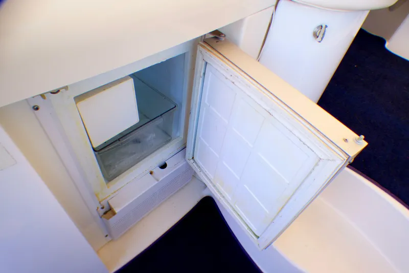Slide: The Image of Open mini fridge in 2003 Formula 37 PC boat interior. - 14