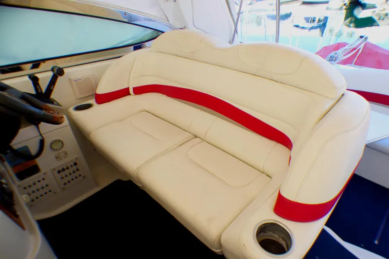 Slide: The Image of 2003 Formula 37 PC boat interior with white and red cushioned seating. - 17