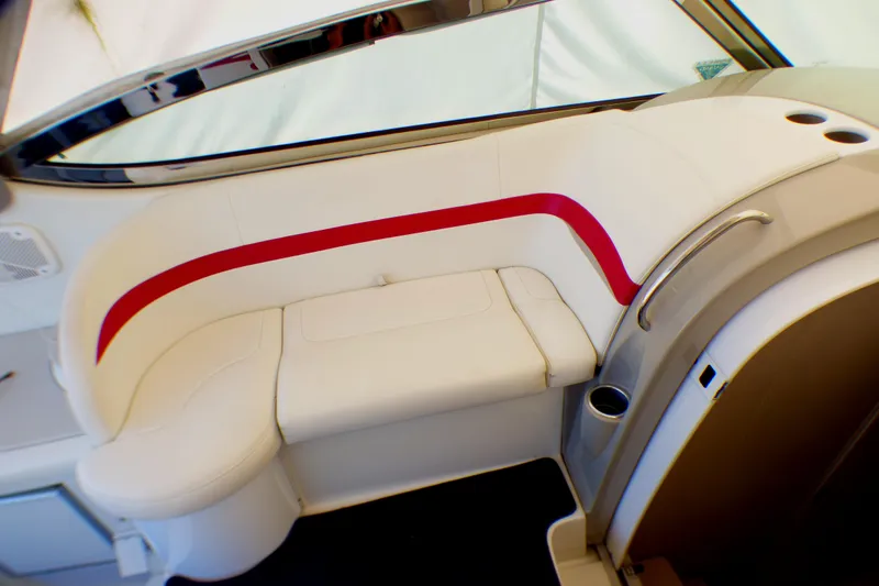 Slide: The Image of 2003 Formula 37 PC boat interior with white seating and red accent stripe. - 18