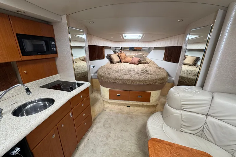 Slide: The Image of Luxurious interior of a 2003 Formula 37 Performance Cruiser with kitchen and cozy bed. - 25