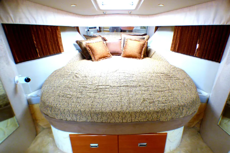 Slide: The Image of Luxurious bedroom interior of 2003 Formula 37 PC yacht with plush bedding and cushions. - 26