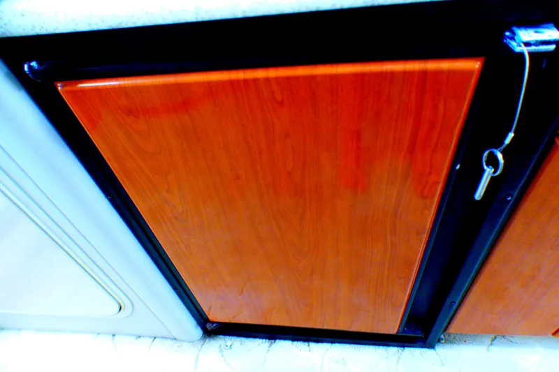 Slide: The Image of 2003 Formula 37 PC wooden cabinet with key, interior detail. - 29