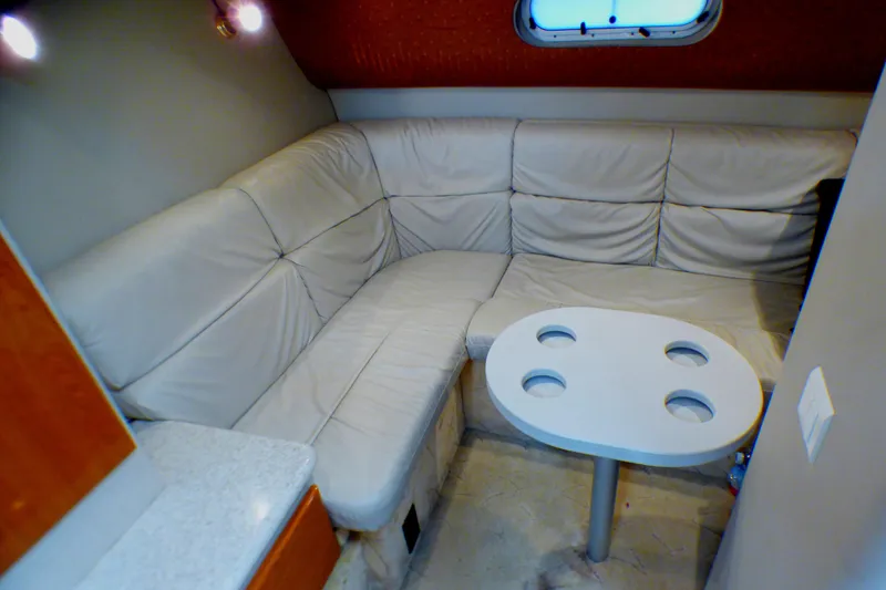 Slide: The Image of 2003 Formula 37 PC interior with beige leather seating and round table. - 34