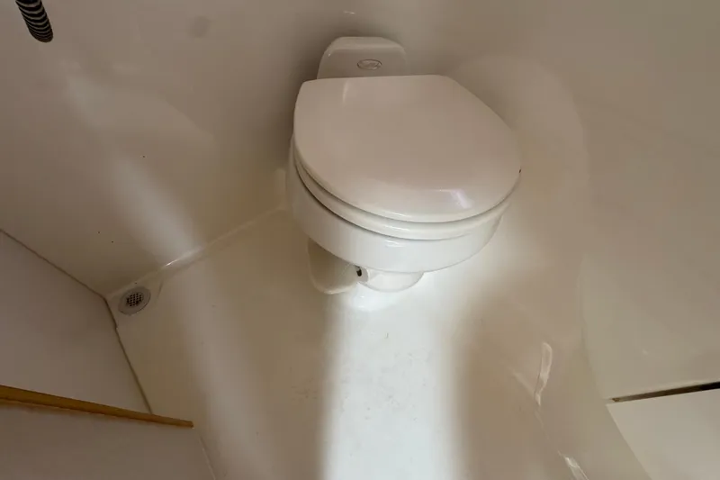 Slide: The Image of 2003 Formula 37 Performance Cruiser bathroom with white marine toilet. - 37