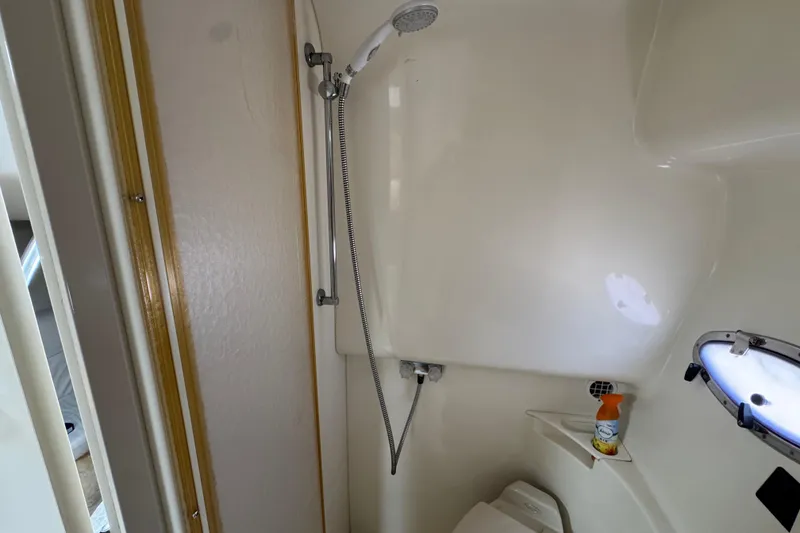 Slide: The Image of Bathroom interior of a 2003 Formula 37 Performance Cruiser with shower and porthole. - 39