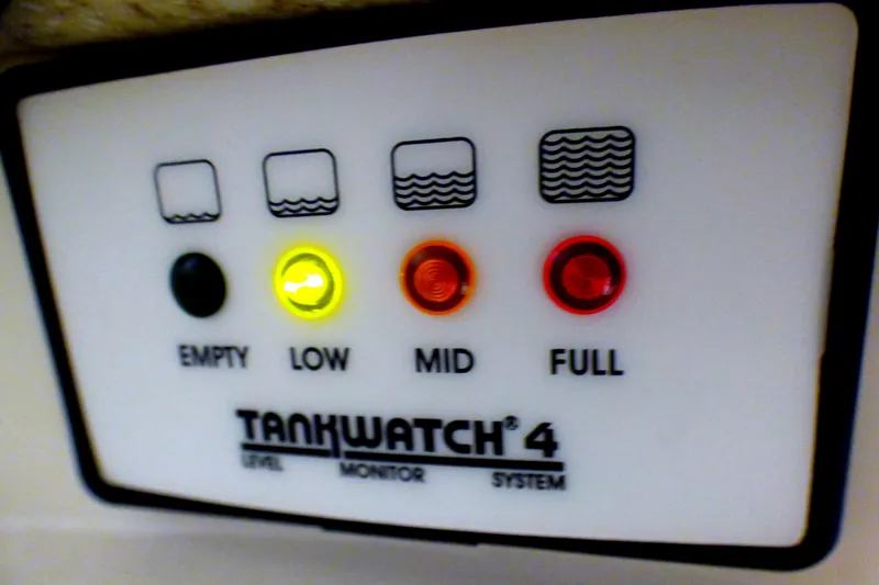 Slide: The Image of TankWatch 4 level monitor system with indicator lights for empty, low, mid, and full levels. - 54