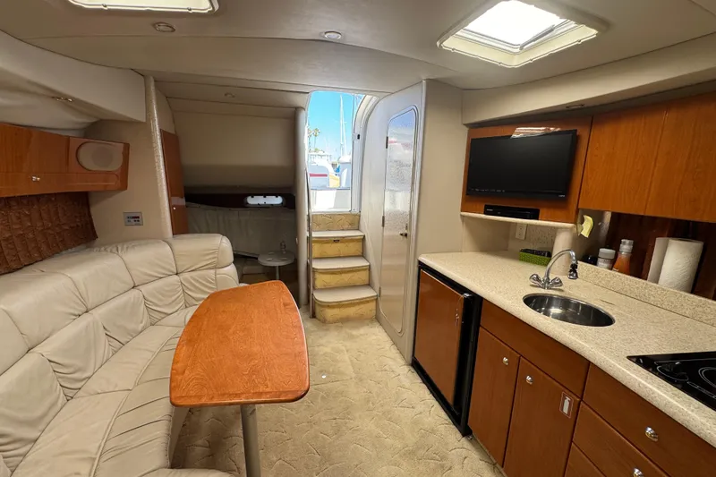 Slide: The Image of Interior of 2003 Formula 37 Performance Cruiser with kitchen, seating, and stairs to deck. - 57