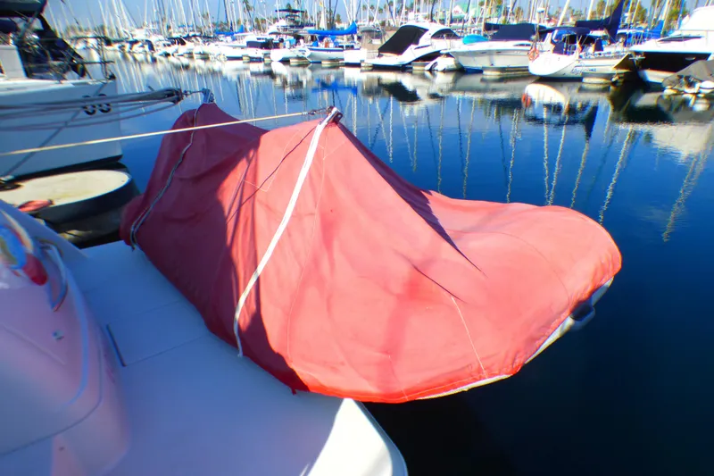 Slide: The Image of 2003 Formula 37 PC boat with red cover docked in marina. - 60