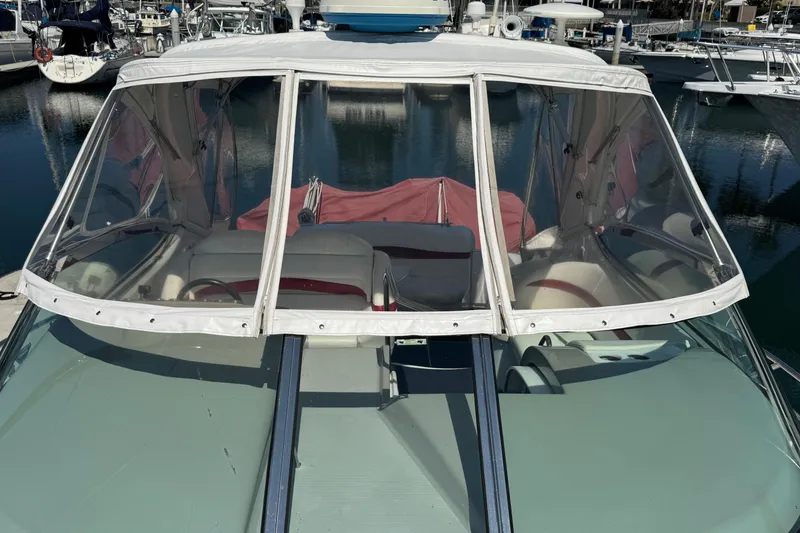 Slide: The Image of 2003 Formula 37 Performance Cruiser at marina, featuring enclosed cockpit and clear canopy. - 8