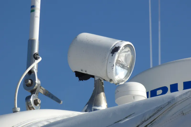 Slide: The Image of 2003 Formula 37 PC boat spotlight and antenna against clear blue sky. - 83