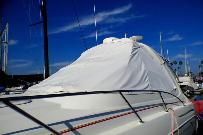 Slide: The Image of 2003 Formula 37 PC yacht covered at marina under clear blue sky. - 86